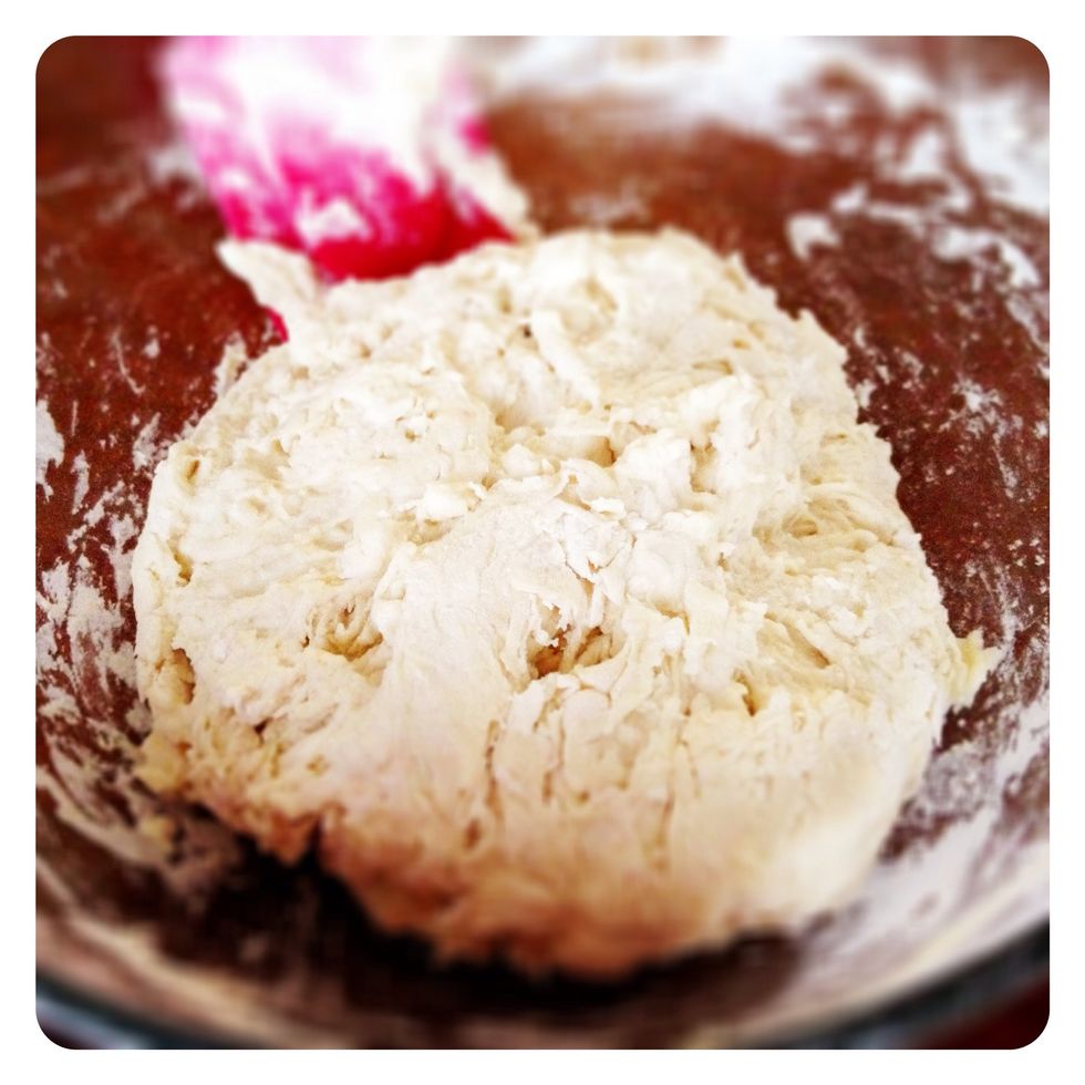 Until the dough forms a ball.