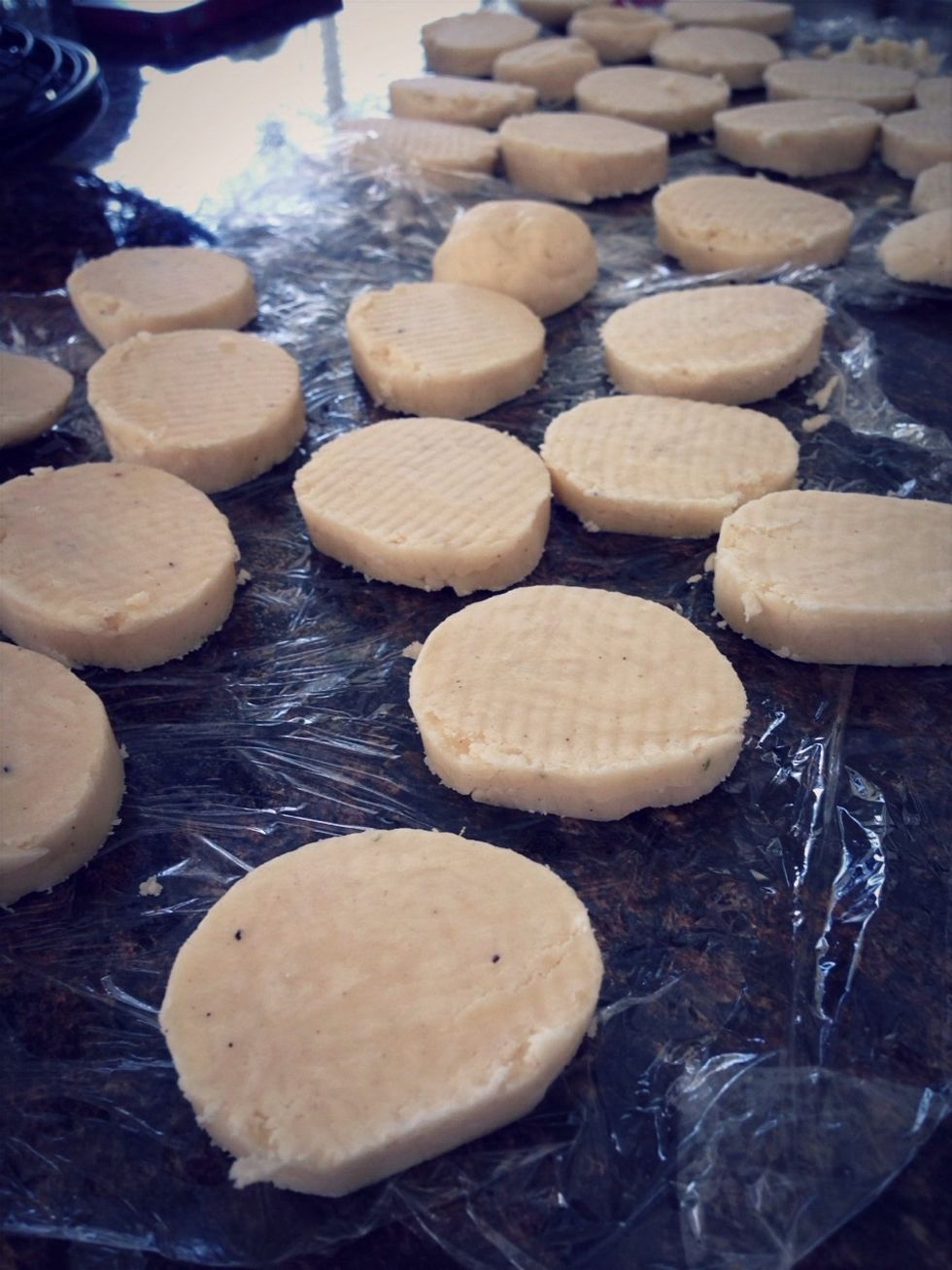 Unwrap dough and carefully cut each log into about 18 slices. Place dough circles 2 inches apart on baking sheet. Bake for 8-10 mins.