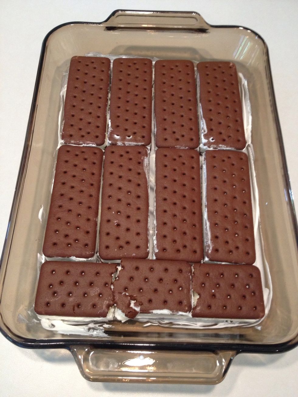 Unwrap ice cream sandwiches and place in pan evenly.