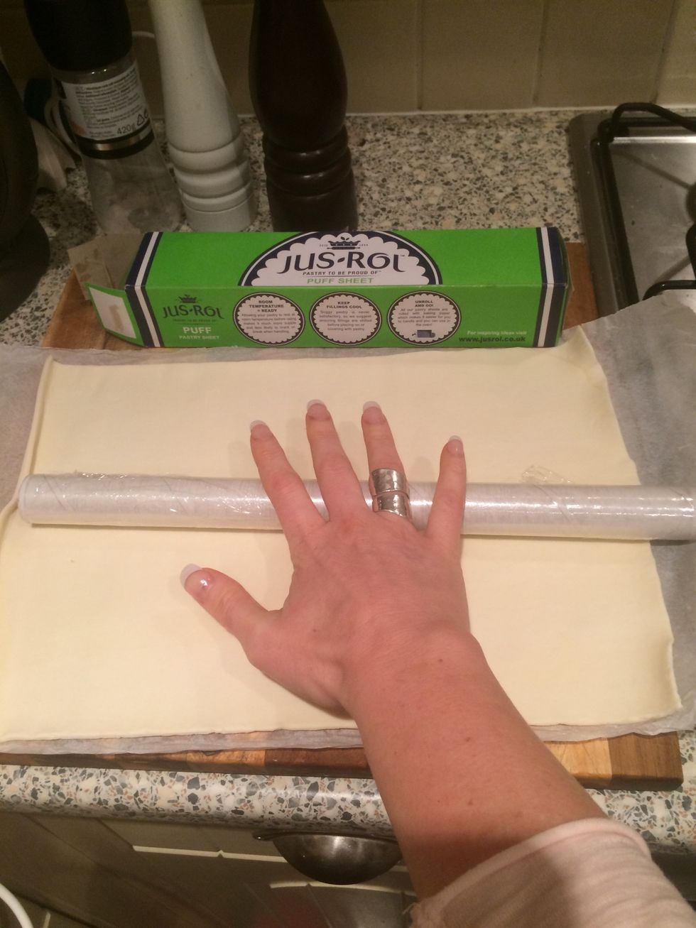 Unwrap puff pastry and roll a little bigger, no rolling pin? Use a cling film roll!