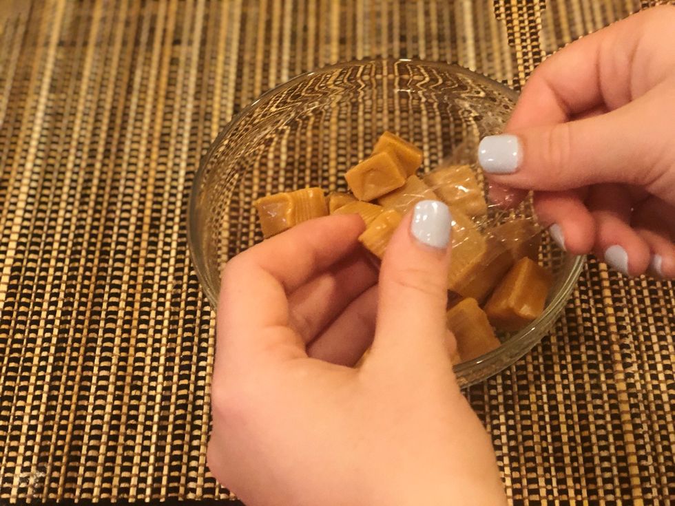 Unwrap the caramel candies and flatten out