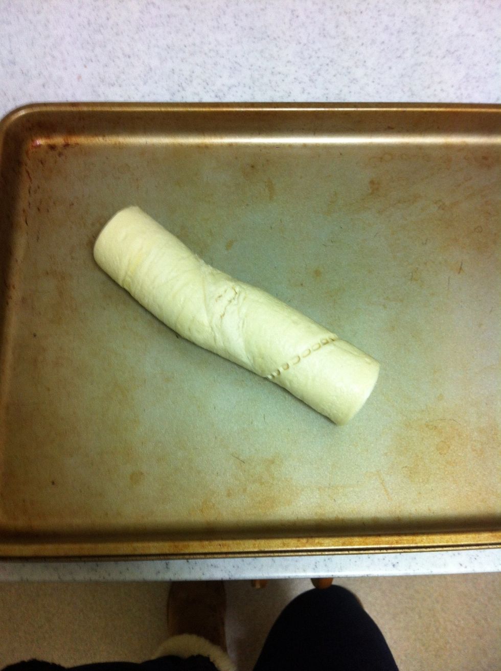Unwrap the crescent rolls on a cookie sheet