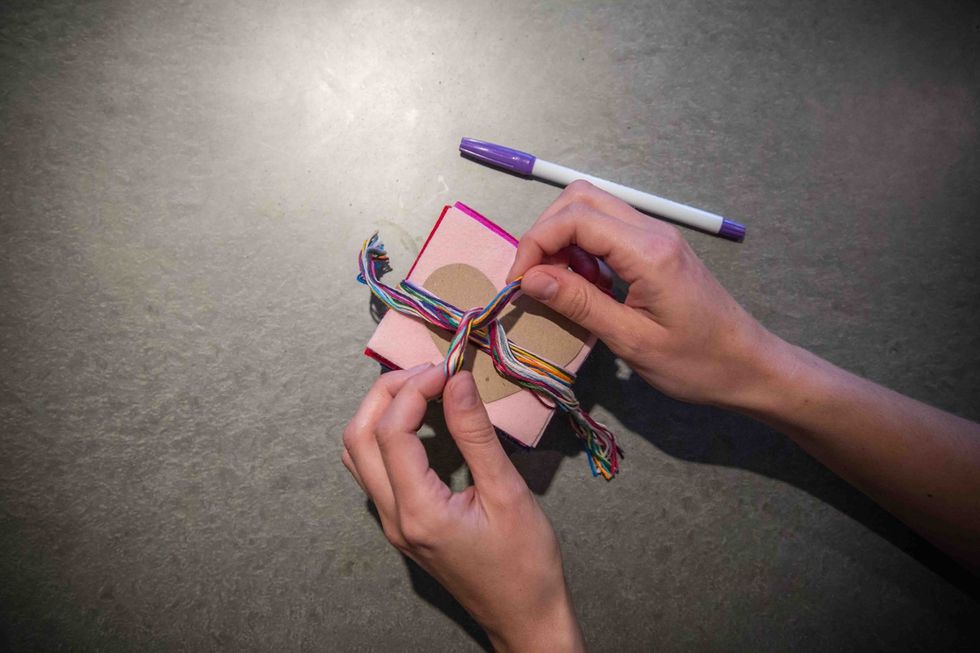 Unwrap the embroidery floss from the felt and heart template.