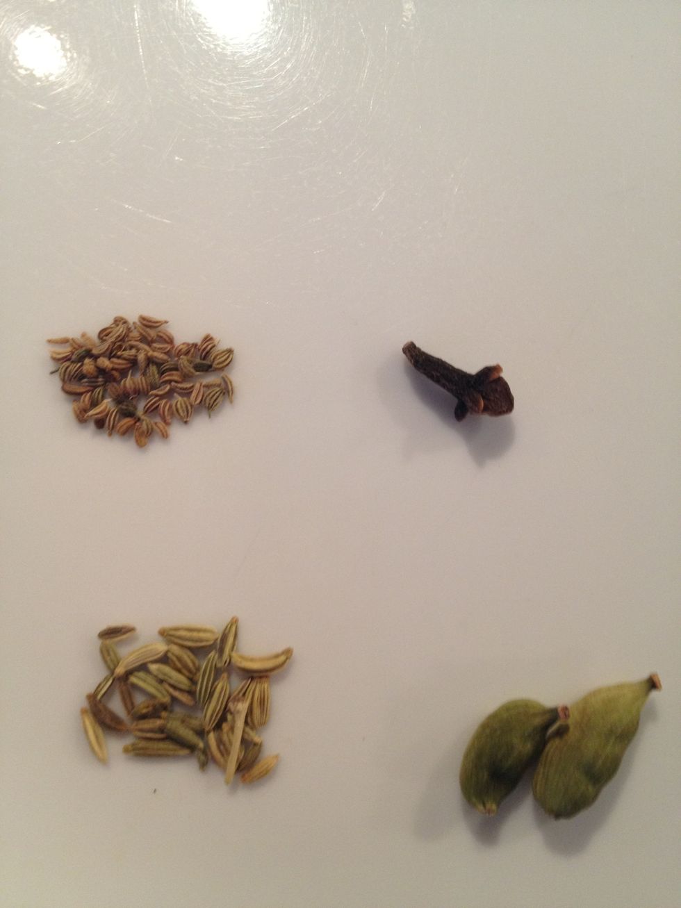 *updated* Top left: carom seed Bottom left: fennel seeds Top right: cardamom Bottom right: clove. If you don't have all of these spices, you can still make the tea. Sometimes I add ginger