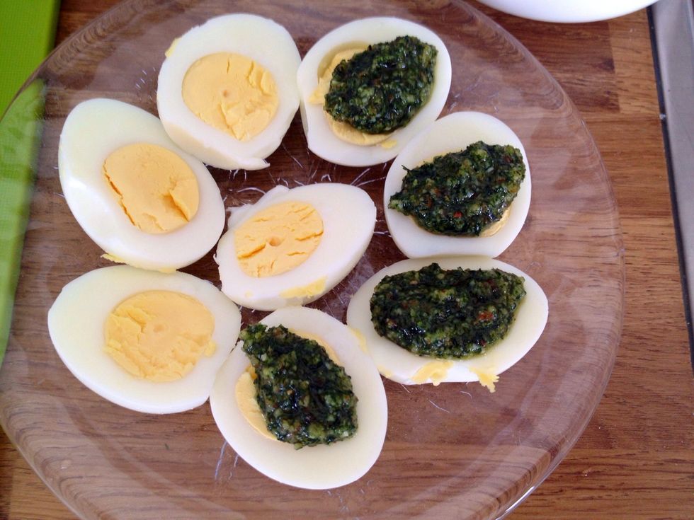 Upon serving; place a spoonful of the dill pesto on each piece of egg.