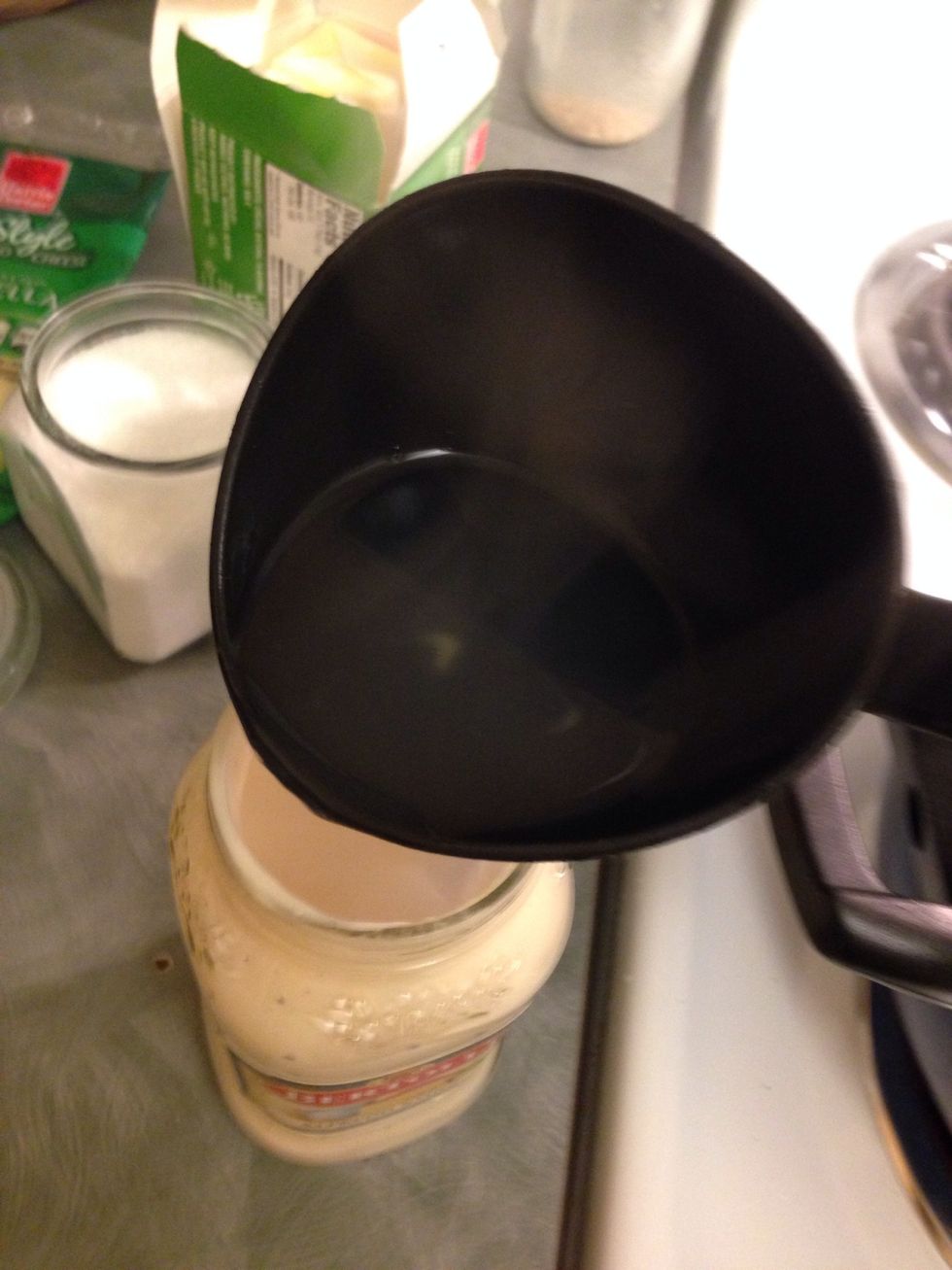 Use 1 ladle of the pasta water. Carefully add to the jar. Let cool for a minute or so then cover with lid. Use a kitchen towel to cover the while  and lightly shake, then add to the mixture.