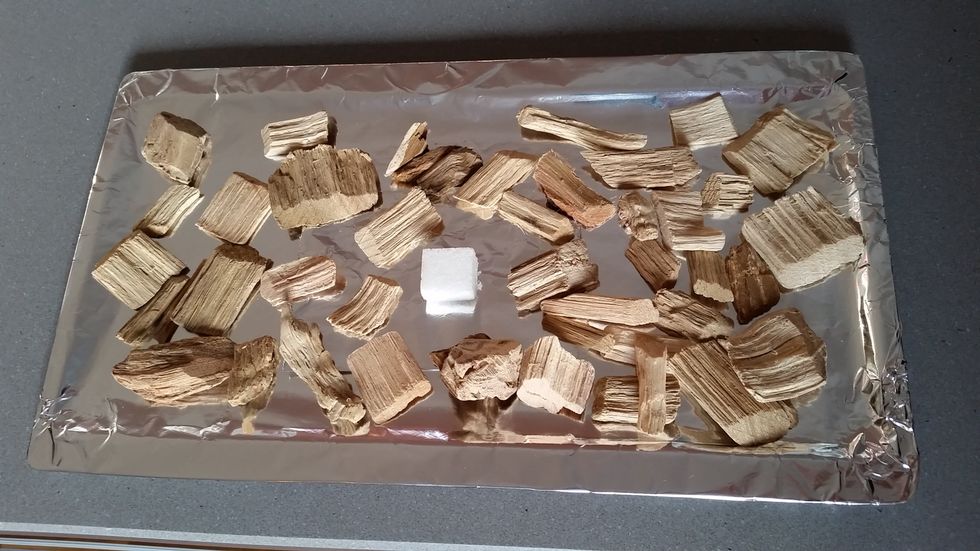 Use 2/3 cup of Alder Wood Chips. You can add a sugar cube to the middle of the wood cheeps, to give the fish a nice golden color.