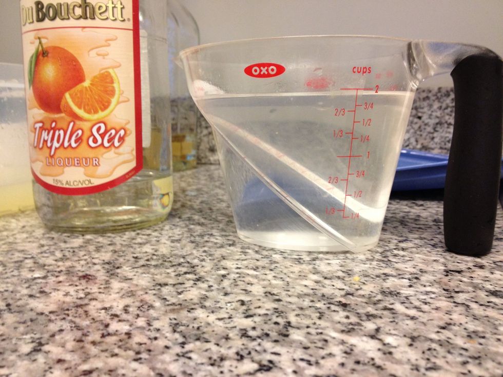 Use 2 cups of Triple Sec. Pour into Tupperware container, with Lime Juice, & Orange Juice