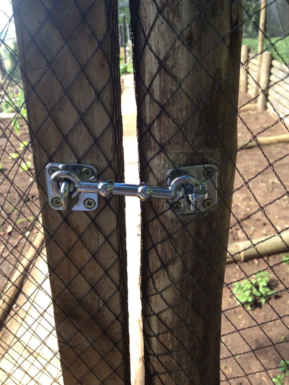 use 2 simple hinges and 8 screws and 1 simple latch to keep your door secured