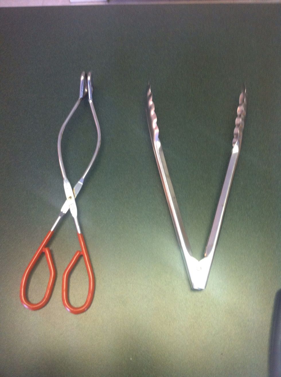 Use 2 visually distinct pairs of tongs. One for raw meat, one for cooked.