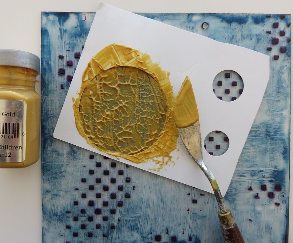 Use 3 different circle punches to make your cardstock stencil. Add Vegas Gold Sorbet paint with pallet knife and lift the knife over the paint to get the texture shown here. Do not touch till dry.