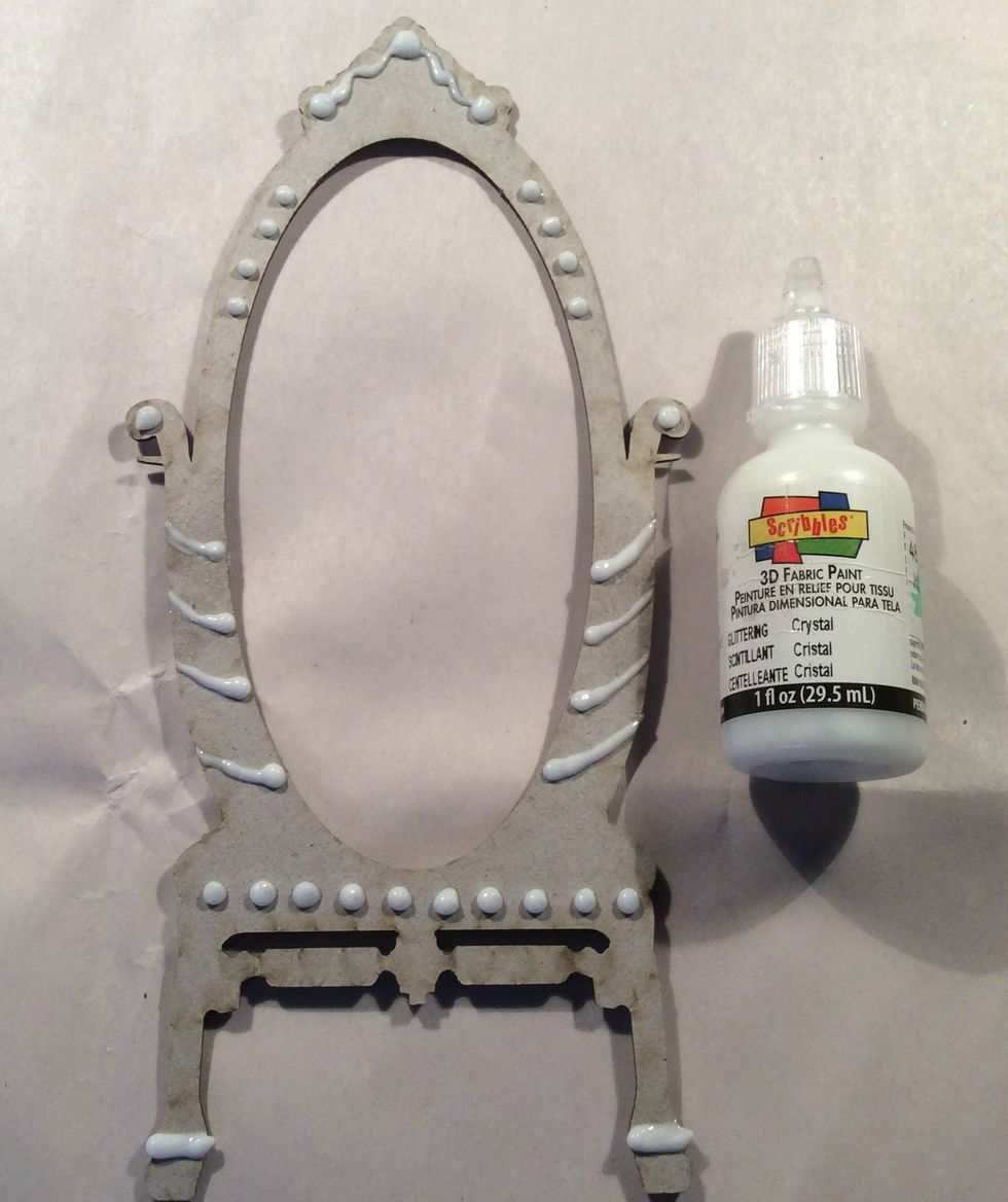 Use 3D Paint and add interest to the chipboard, scrolls, dots, lines etc. Allow to dry completely. Then paint the entire piece with white acrylic paint.