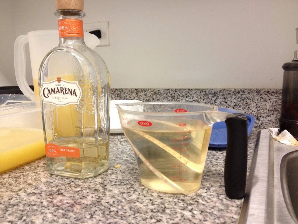 Use 4 Cups of Anejo Tequila. Split total into 2 parts. 2 Cups go into the pitcher with half of the mix. 2 Cups go into the Tupperware container for later.