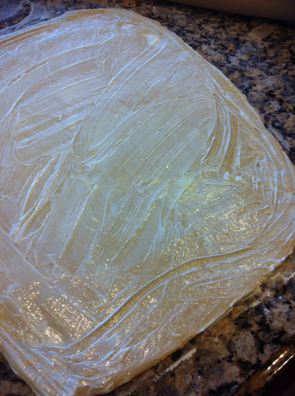 Use 4 TB softened butter and spread all over the dough