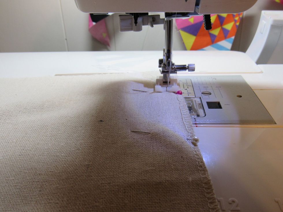 Use a 1/4 or 1/8 inch seam allowance and sew the two pieces (long ways) together.