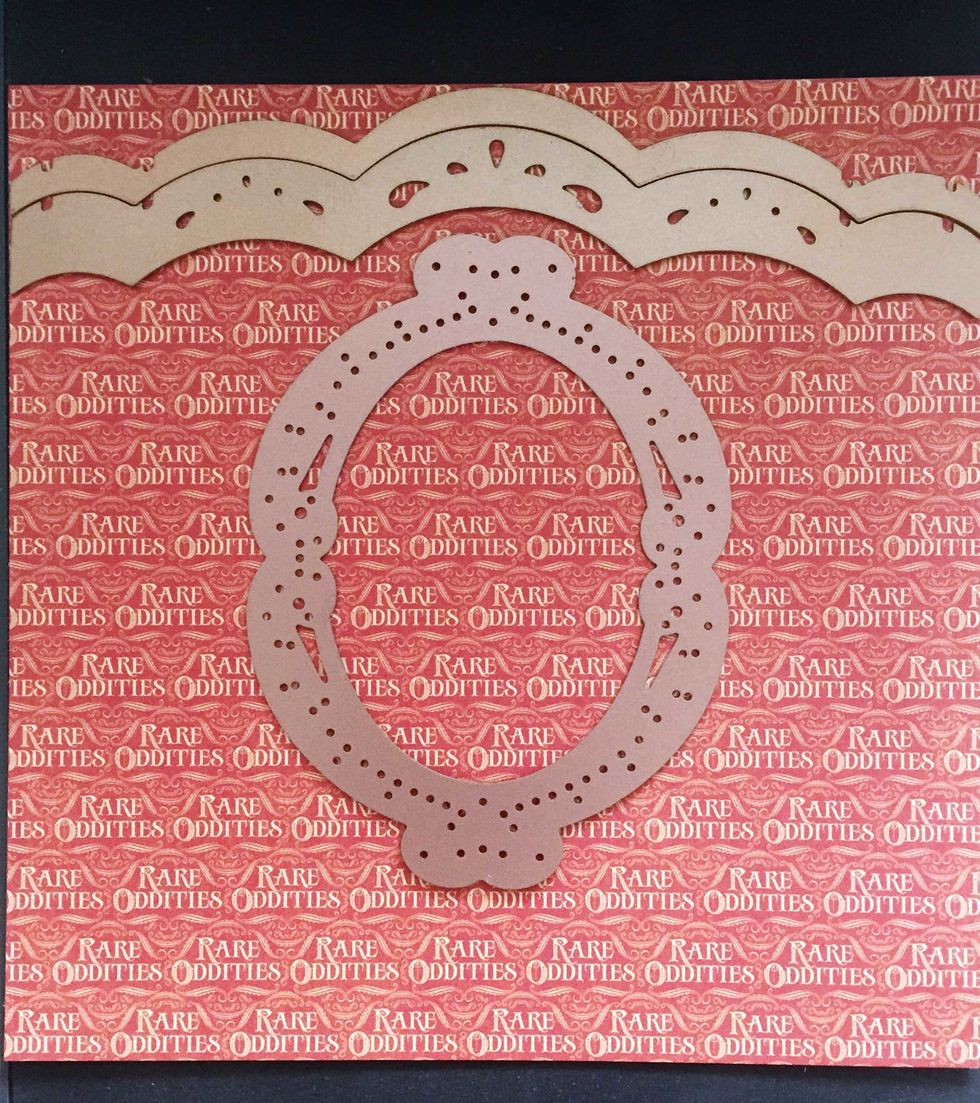 Use a 6" x 6" paper (or cut from a paper of your choice) from the solid & pattern paper pad, place the Spellbinders dies as follows - scallop border dies on top & the oval die below, near the center.