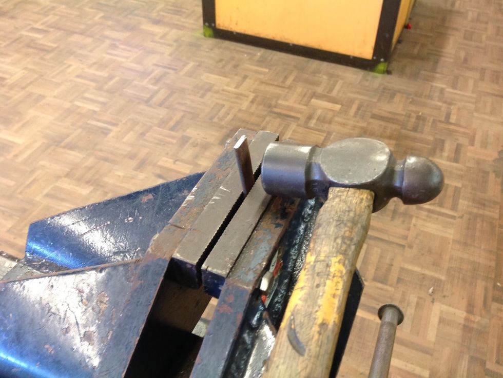 Use a ballbein hammer to bend the edges of your stand