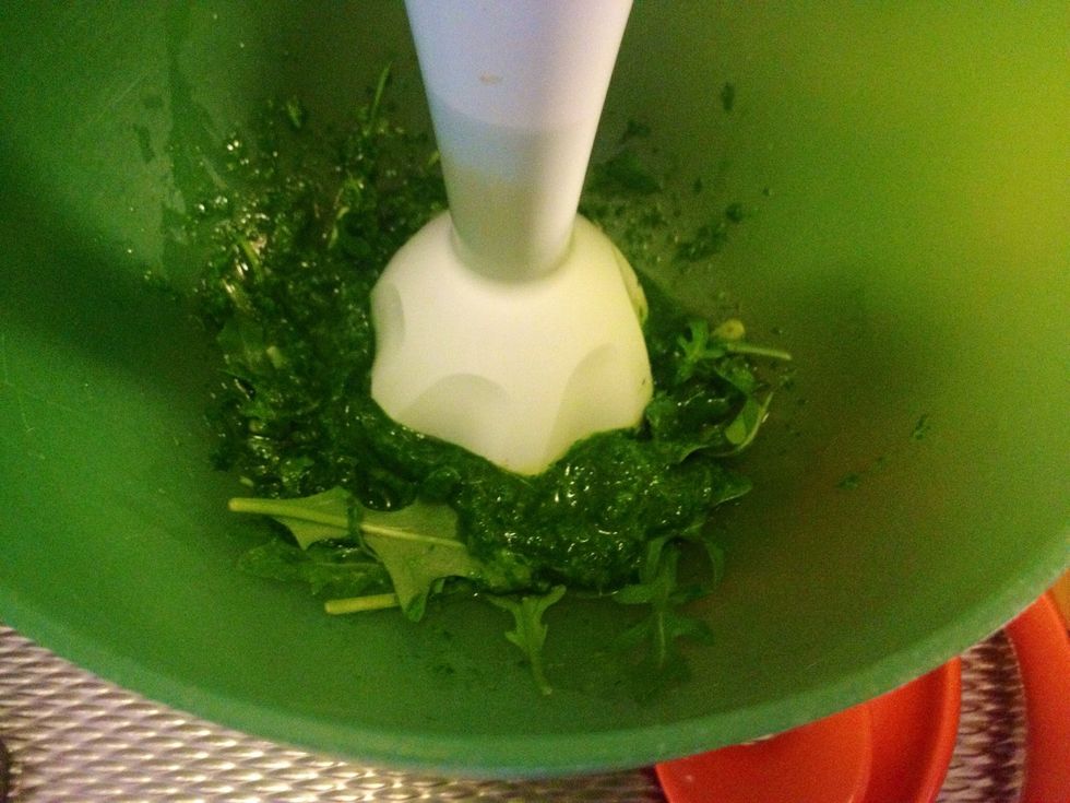 Use a blender to mix the rocket with the olive oil.