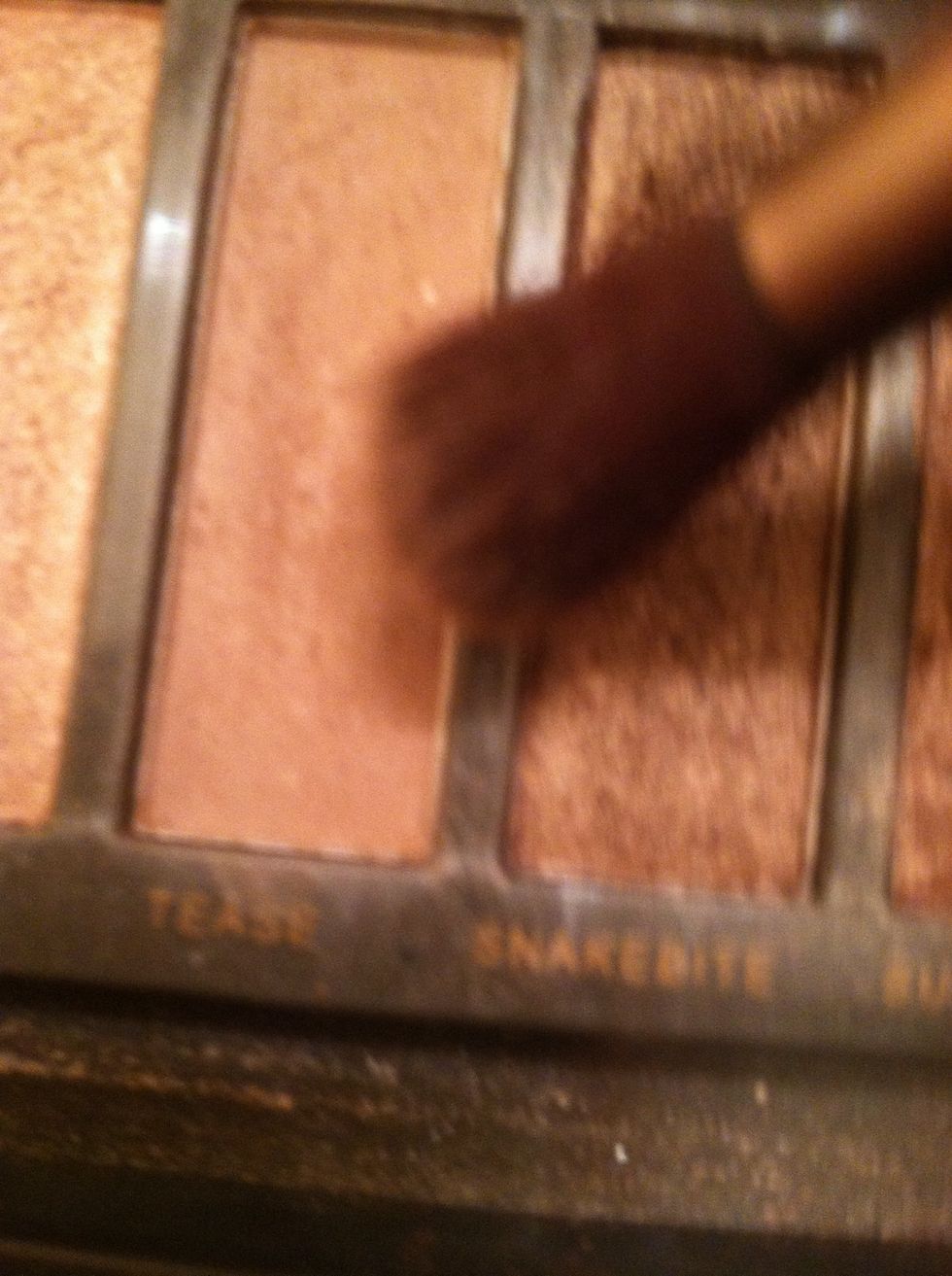 Use a blending or fluffier eye shadow brush and get your light matte brown shade. I'm using "tease" from my naked 2 pallette