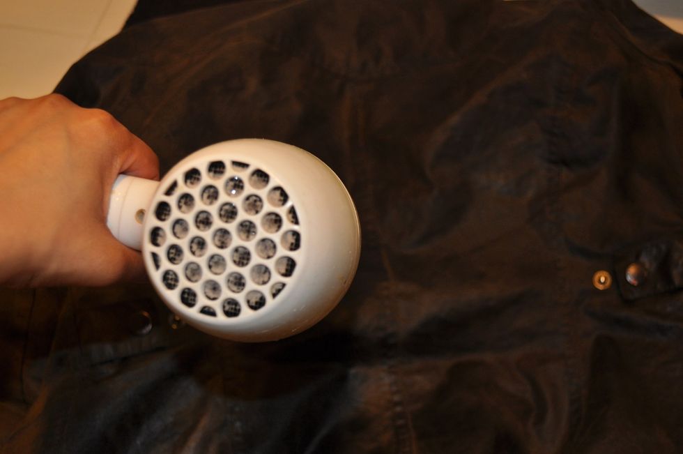 Use a blow dryer to start the drying process and to help it bond. Pay special attention to the seams.