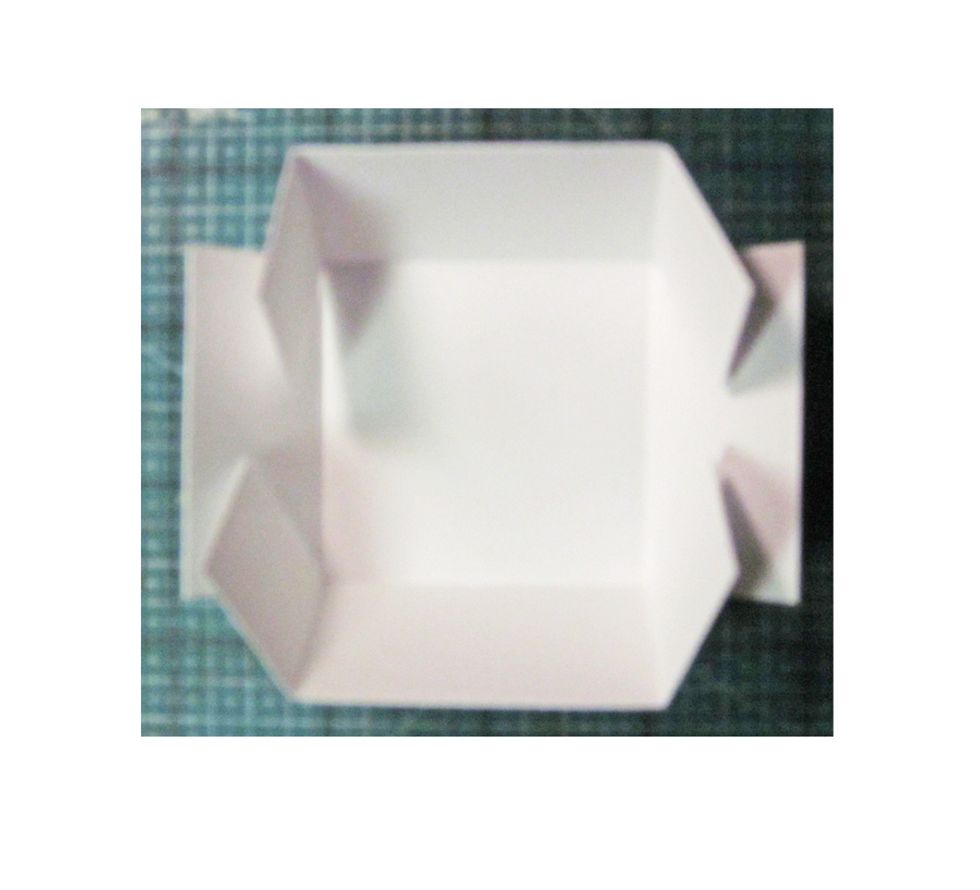 Use a bone folder and fold at all the scored marks.