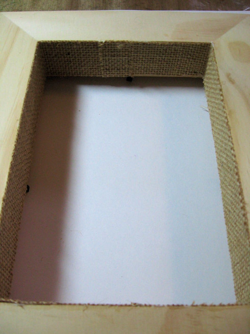 Use a bone folder or the edge of a ruler to burnish the burlap to the frame, pressing out all air bubbles as you go. Set aside to dry thoroughly.