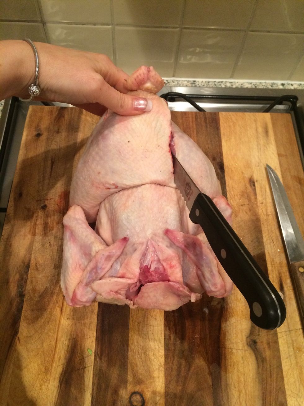 Use a bread knife or sharp strong knife to cut out "spine" bone