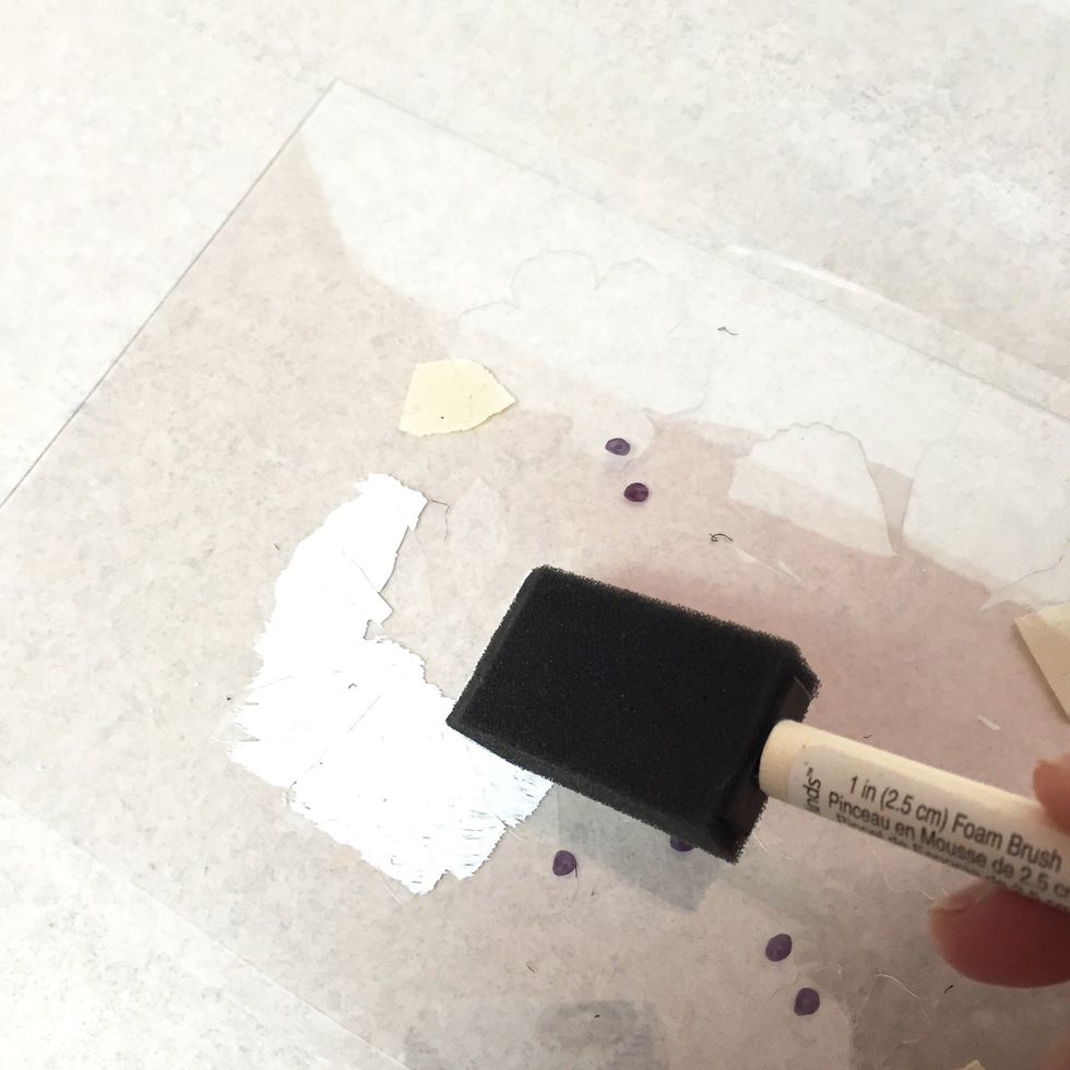 use a brush to apply white paint to stencil using a dabbing motion. make sure you apply enough paint so that design will transfer, but using too much will cause a very blurry image. experiment!