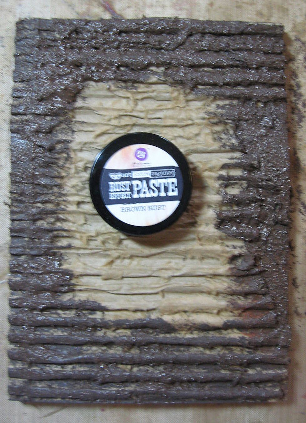 Use a brush to pounce the darkest paste around the edges of your panel.  The center will be covered, so no need to waste materials.