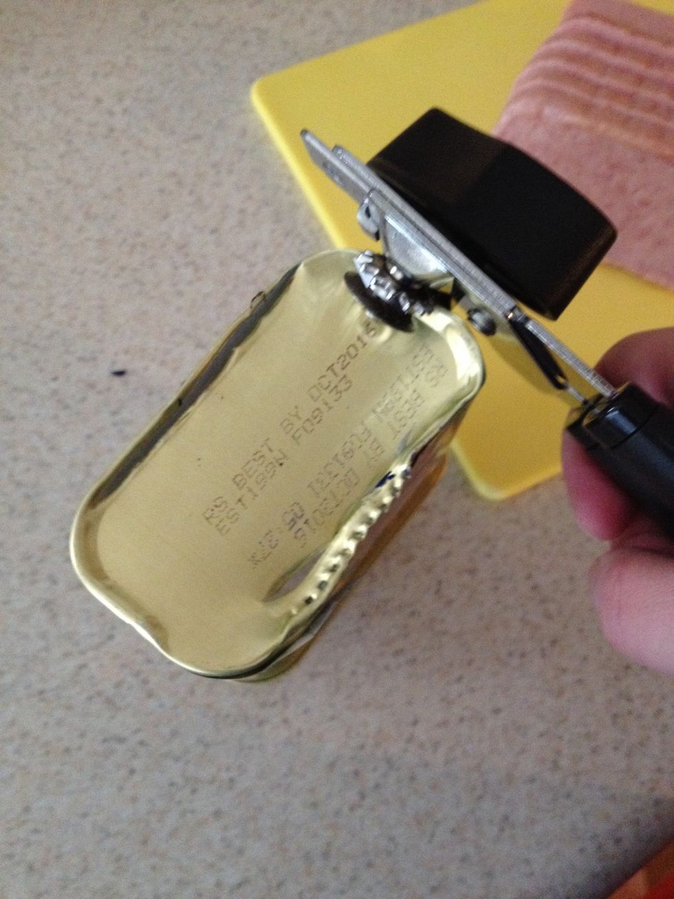 Use a can opener to open the bottom of the spam can. It will not be easy and BE CAREFUL! The sides will be sharp. Set the mold aside.
