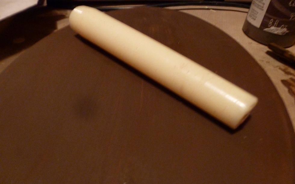 Use a candle to draw wax onto areas that you want the dark color to show through creating a wax resist.