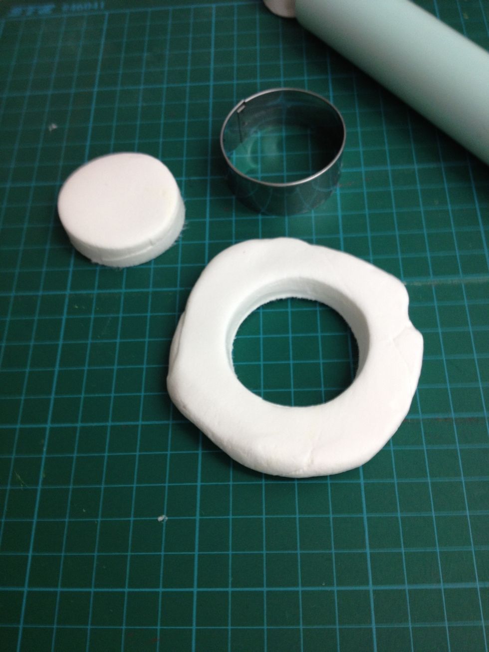 Use a cookie cutter and make 2 white circles.