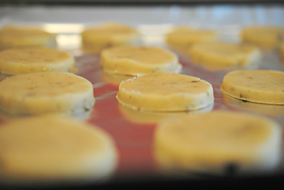 Use a cookie cutter to cut out your cookies. These are about an inch and a half in diameter (which makes about 48 cookies). Place them on an ungreased cookie sheet.