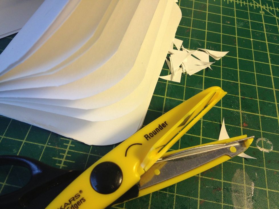 Use a corner rounding scissor if you want rounded corners.