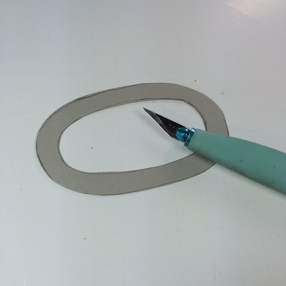 Use a craft knife to cut away the center.