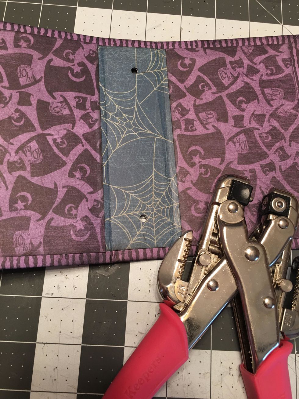Use a Crop-a-dial to punch two holes as shown. Use the largest hole punch.