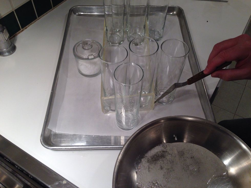 Use a cute little off-set spatula- what? You don't have one? Okay, a sharp knife will do. Apply the melted goo- no not you- your mother, to the corners. Let it sit 5-10 minutes.