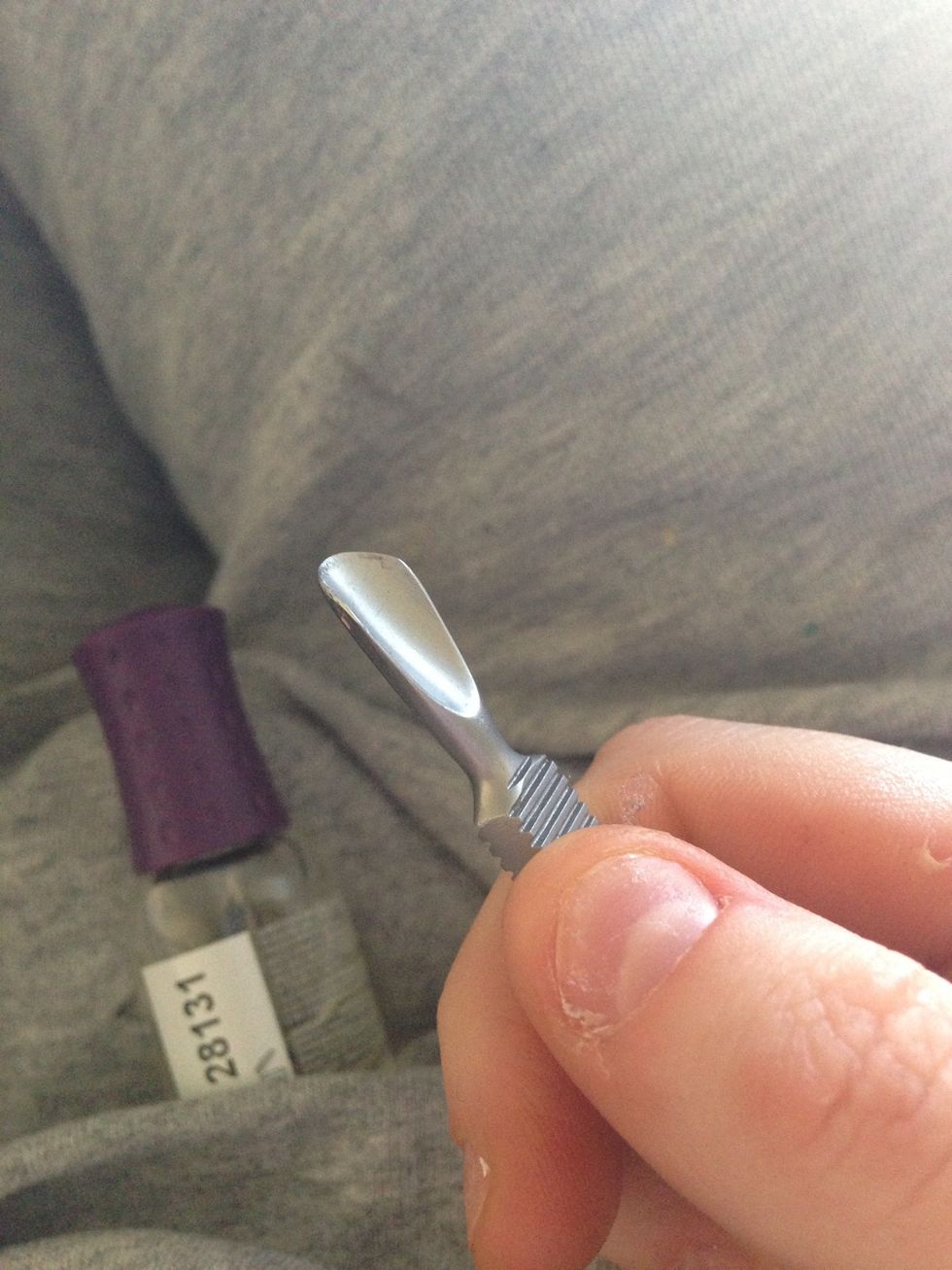 Use a cuticle pusher to gently push back every angle of the cuticle. When I don't have one, I use something that has the same shape. Not as effective, but you got to do what you've got to do!