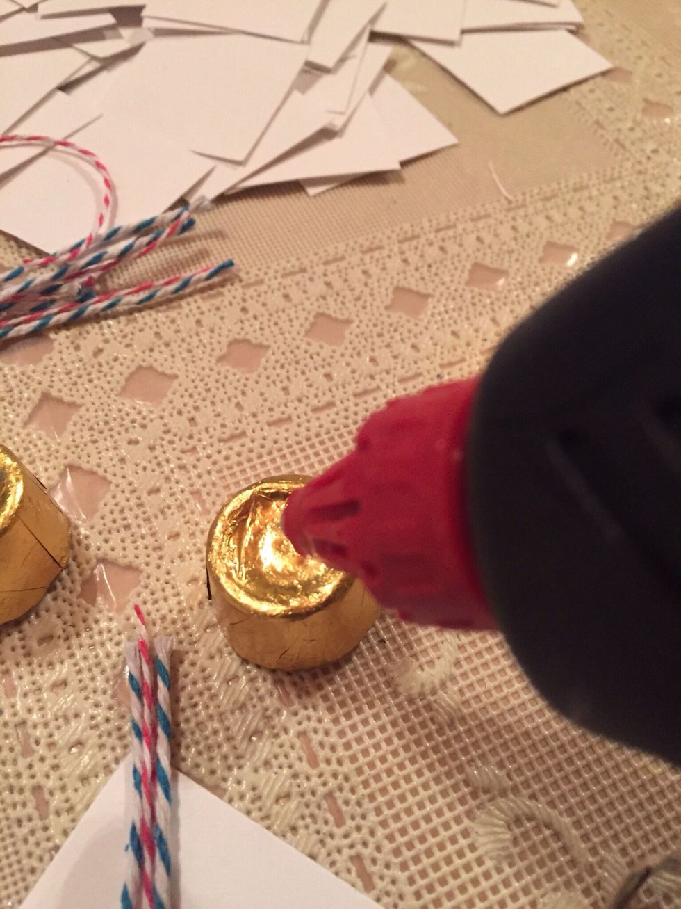 Use a dab of glue to to Rolo candy, and then attach 'mortarboard'.