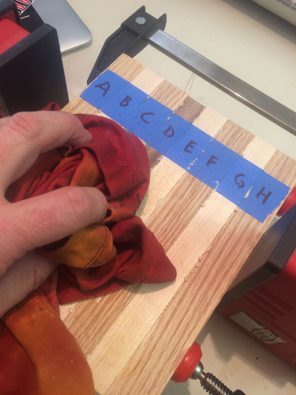 Use a damp cloth to remove excess glue from top and bottom surface.