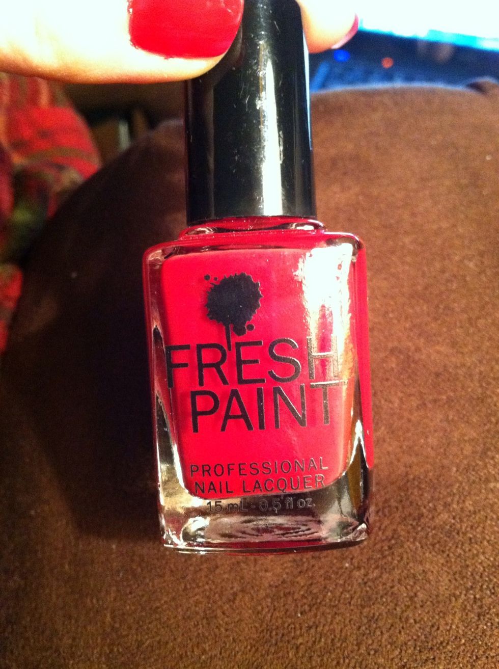 Use a deep red nail polish for your first coat. Apply to all nails.