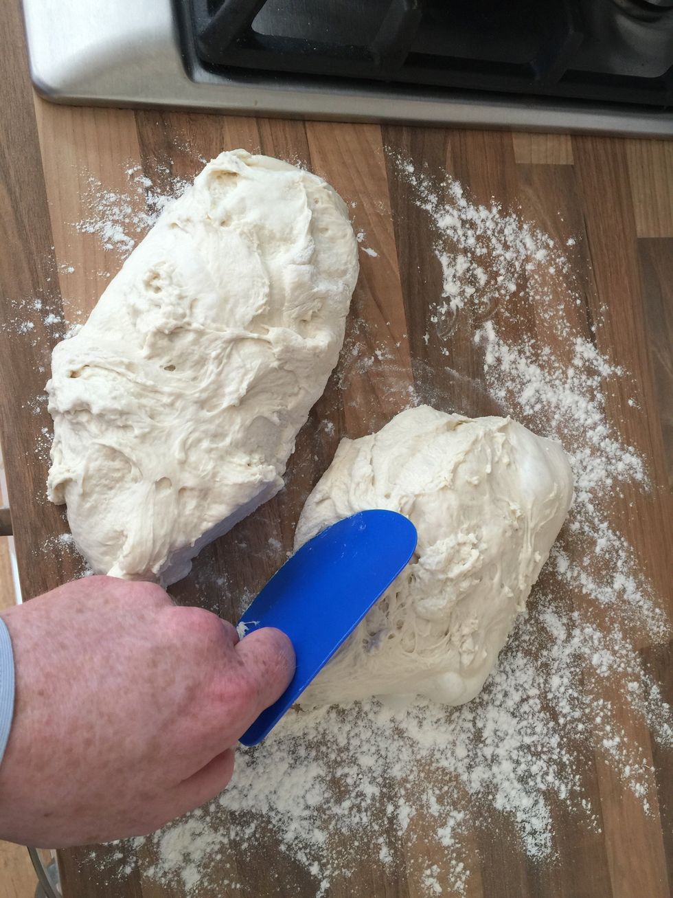 Use a dough-scraper if you have one, otherwise use a knife to half the dough.