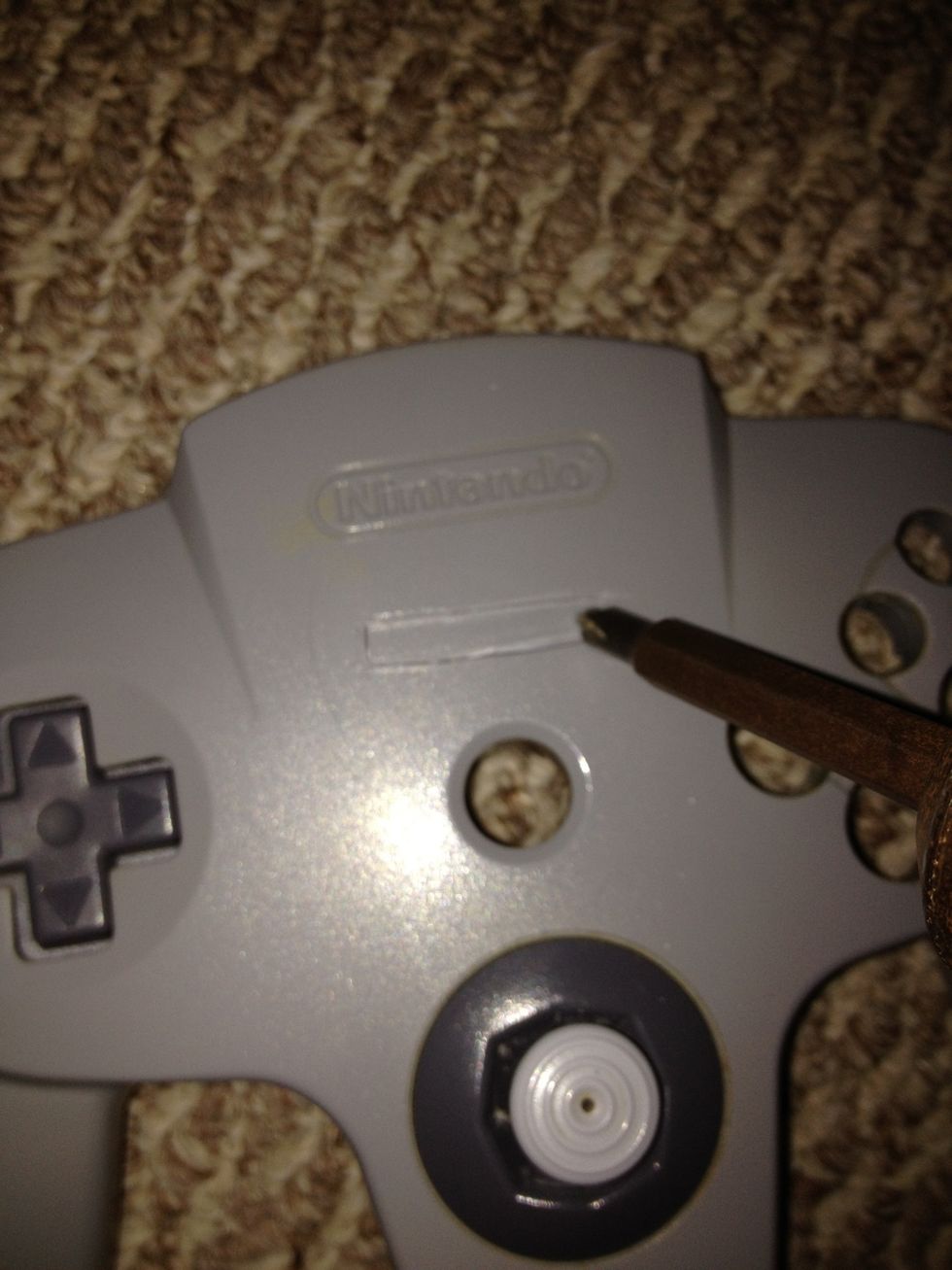 Use a drill to make holes in the marking you created allocated for the USB. Drill a few holes horizontally. Then with the sharp knife clean out the cut space making the slot smooth.