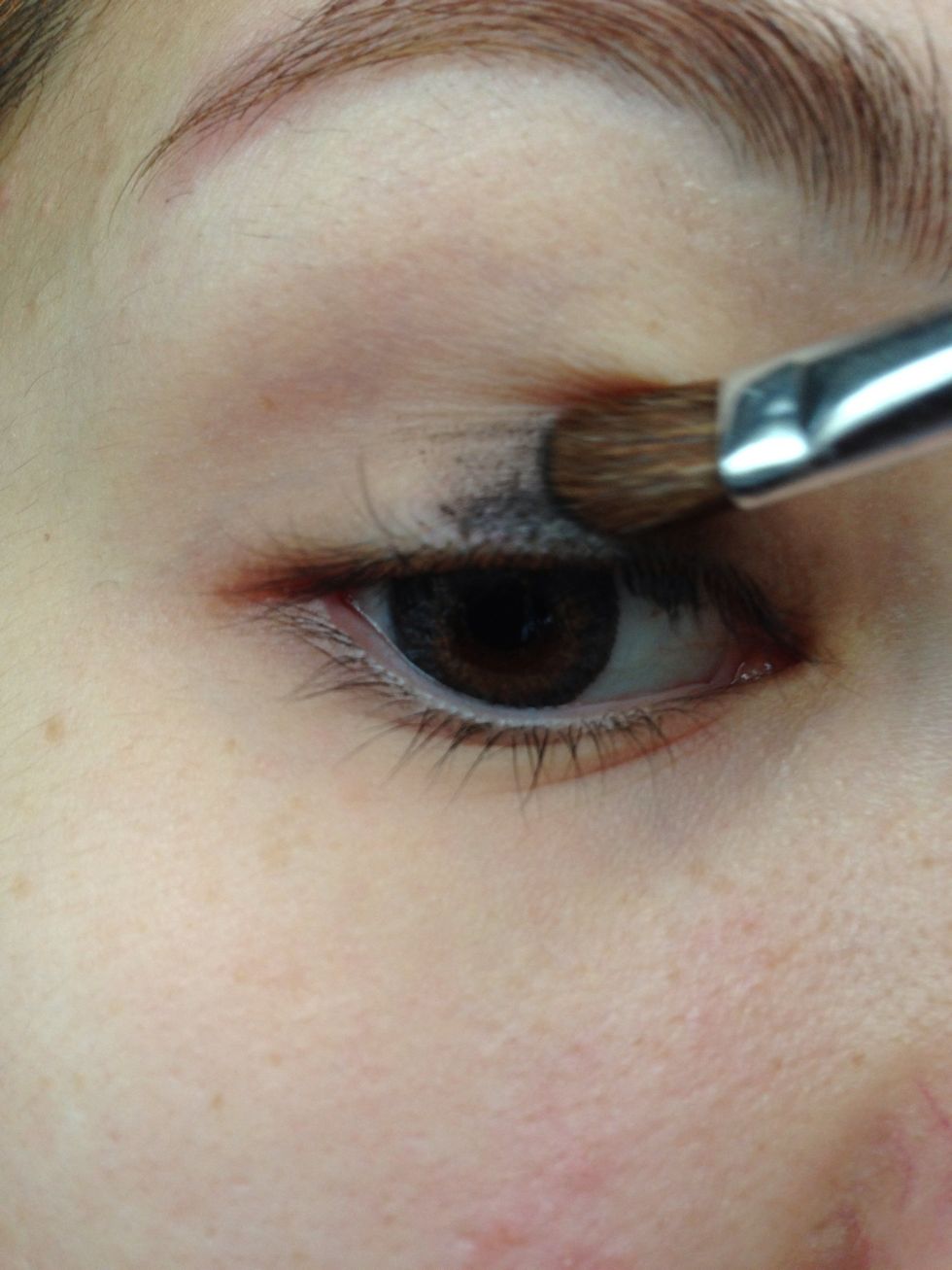 Use a flat shadow brush to apply the cream shadow. This is acting as the shadow's base, so you don't have to be too neat with this application.