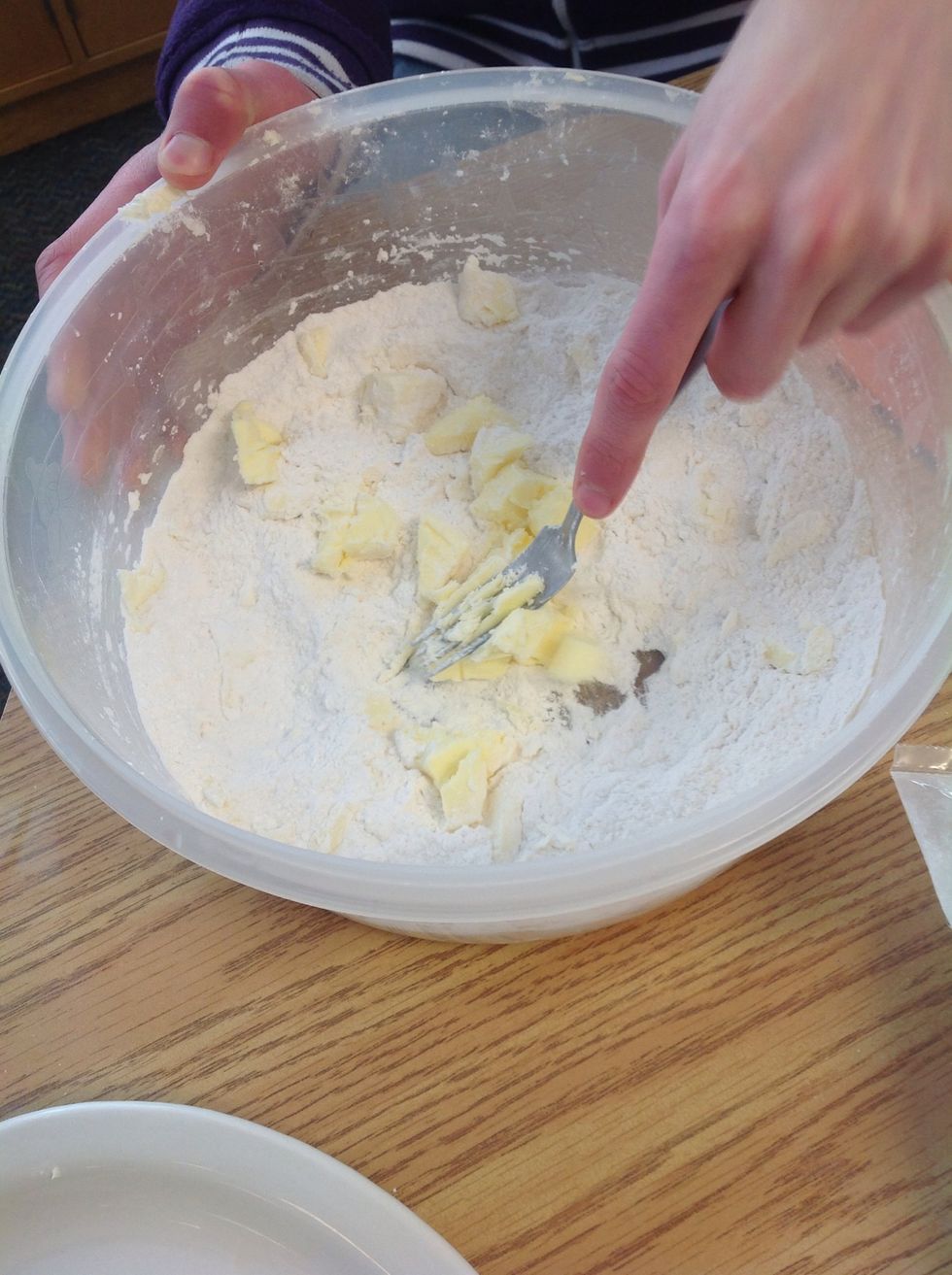 Use a fork to squish the butter into small pieces with flower tell fluffy .