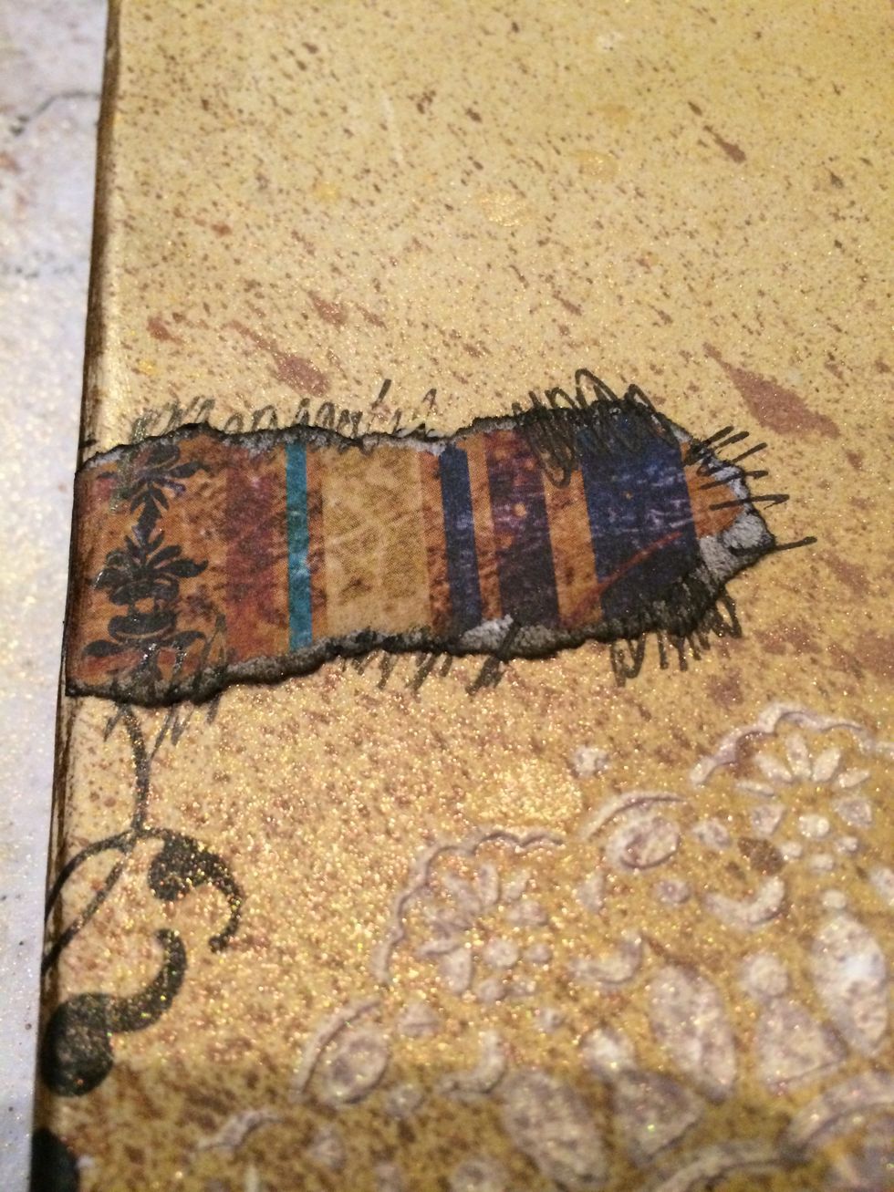 Use a gel pen, and add zig zags to the torn pieces of paper for added visual interest.