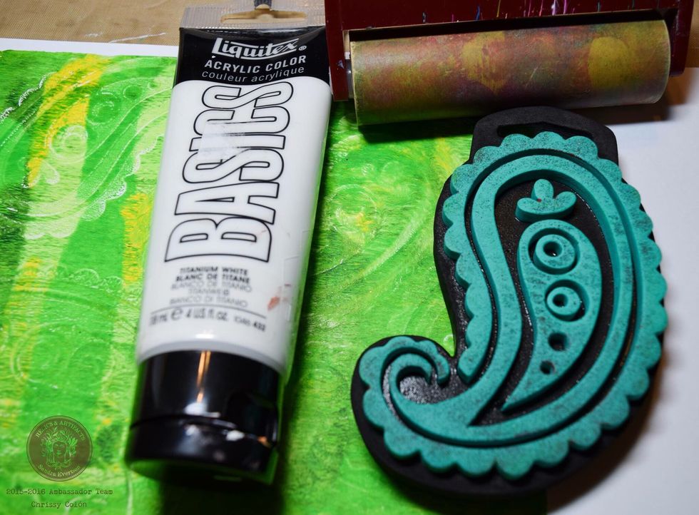 Use a Gelli Plate and acrylic paint and create a background print. Stamp with white paint and a foam stamp.