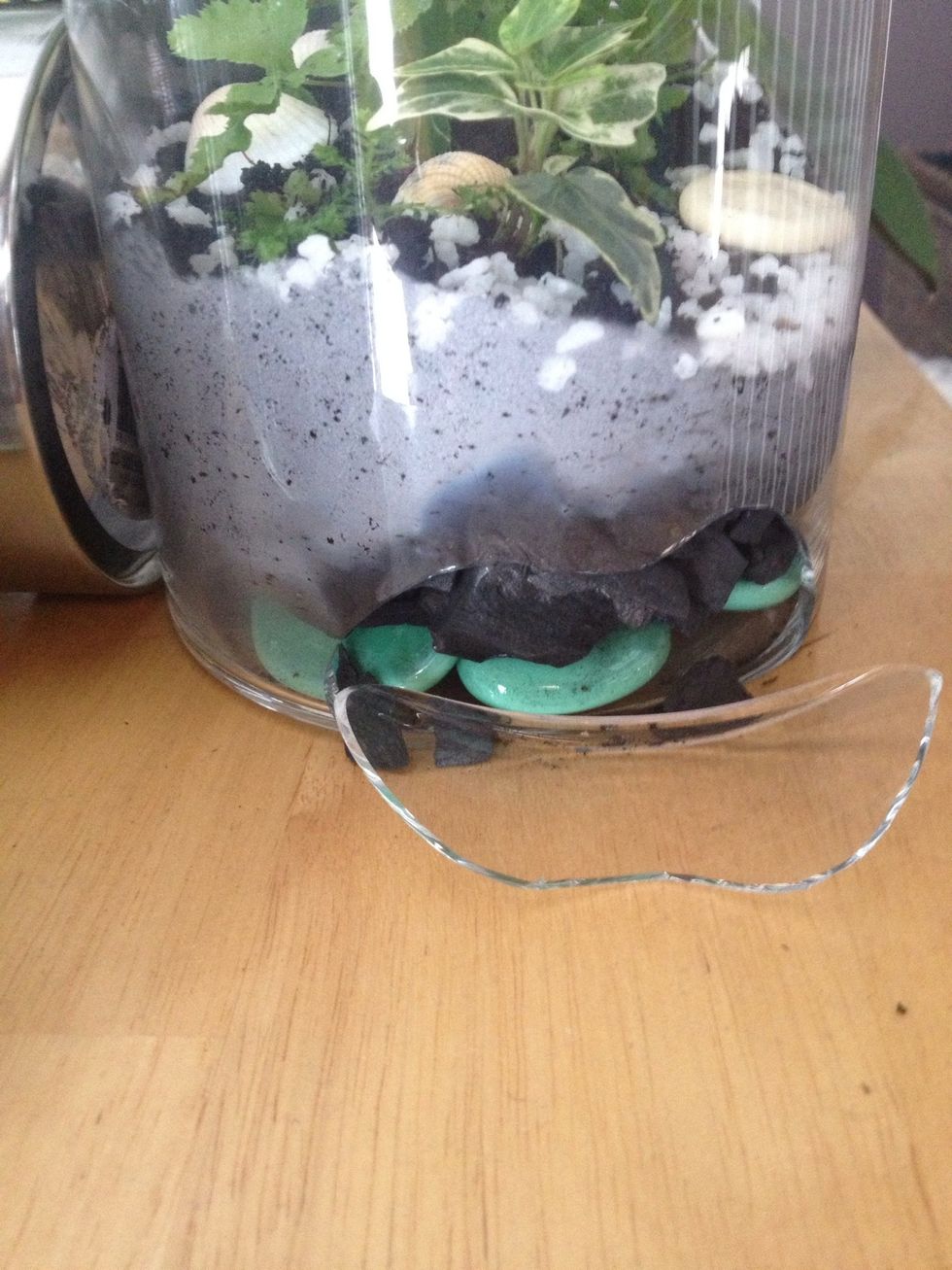 Use a glass container! I bought one plastic container because I loved it's shape and lid and when I woke up, it was broken. It may have been the pressure next to the rocks in a condensed container. :(