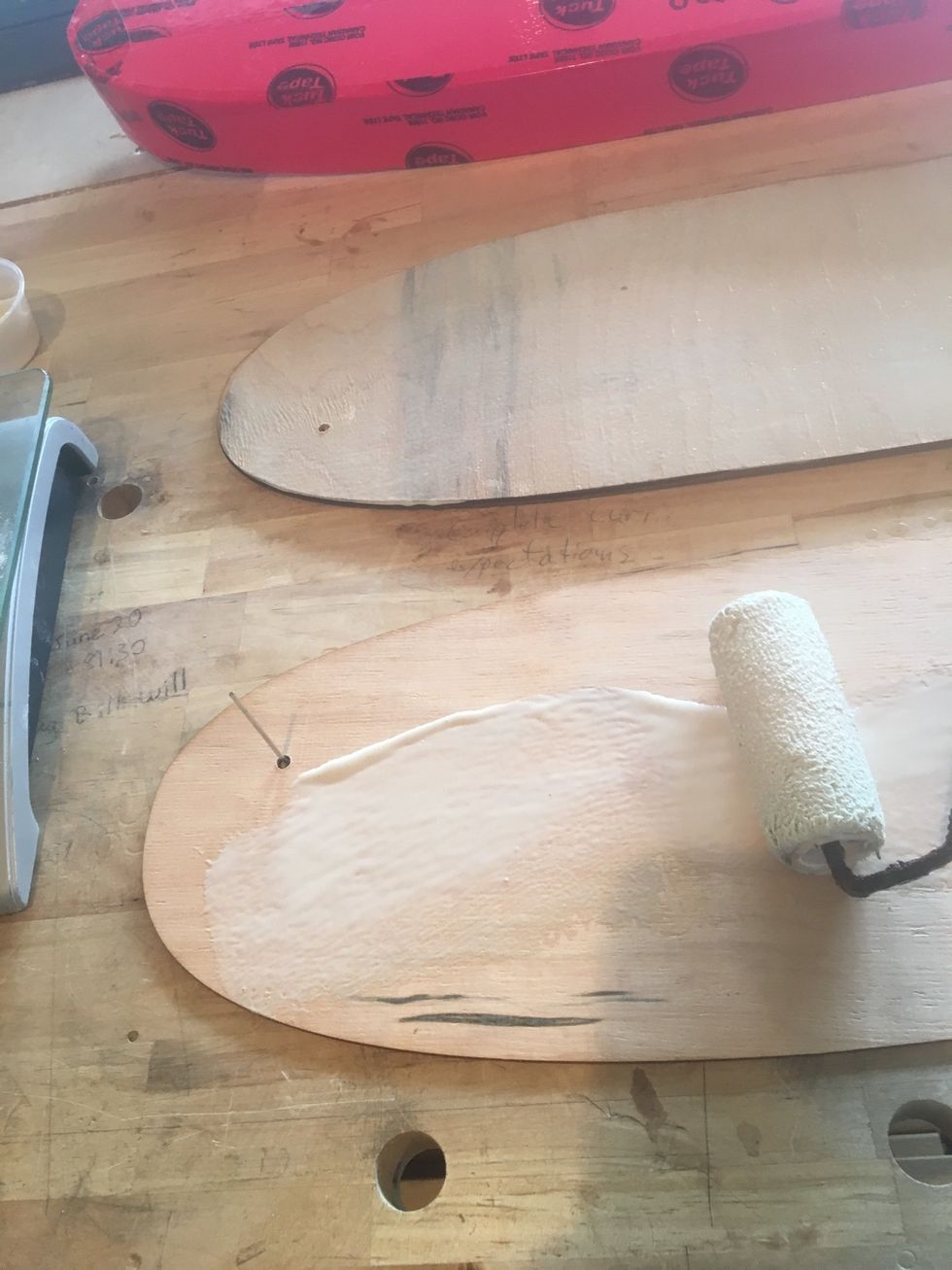 Use a glue roller to distribute the glue evenly.