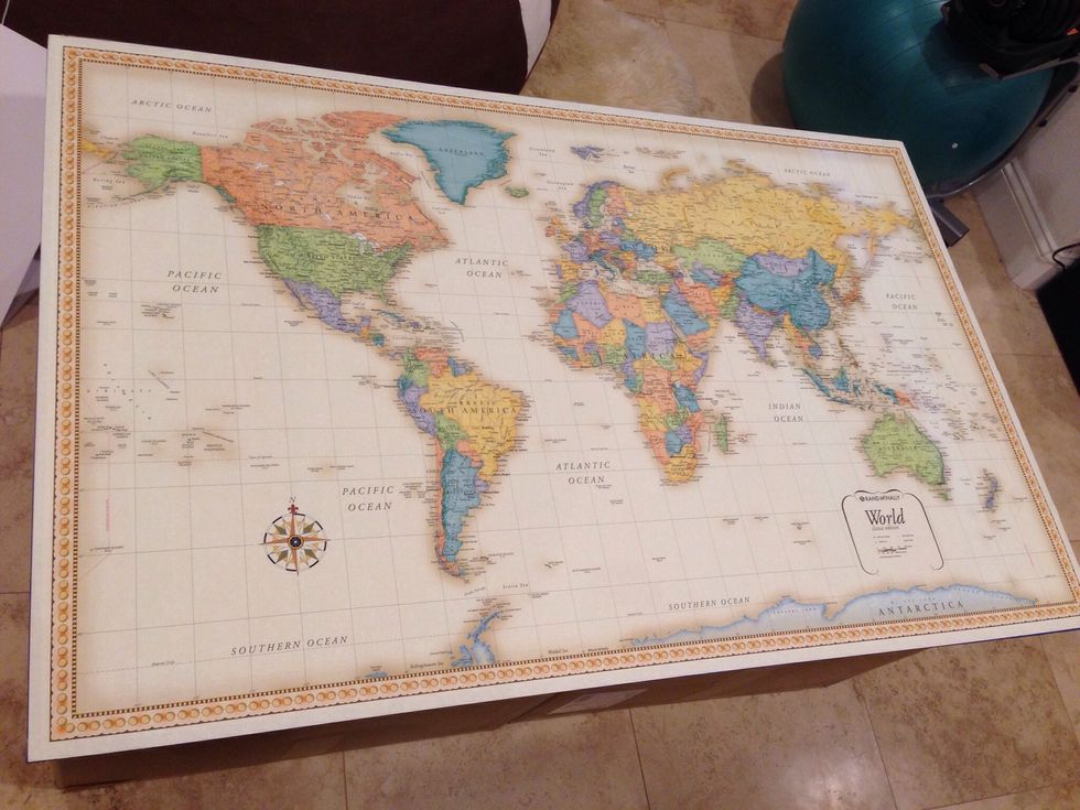 Use a glue stick to bind the map to the board. I left certain places unglued so I could get a sweet wrinkled look at the end. If you want the map to be flat literally cover the whole board with glue.
